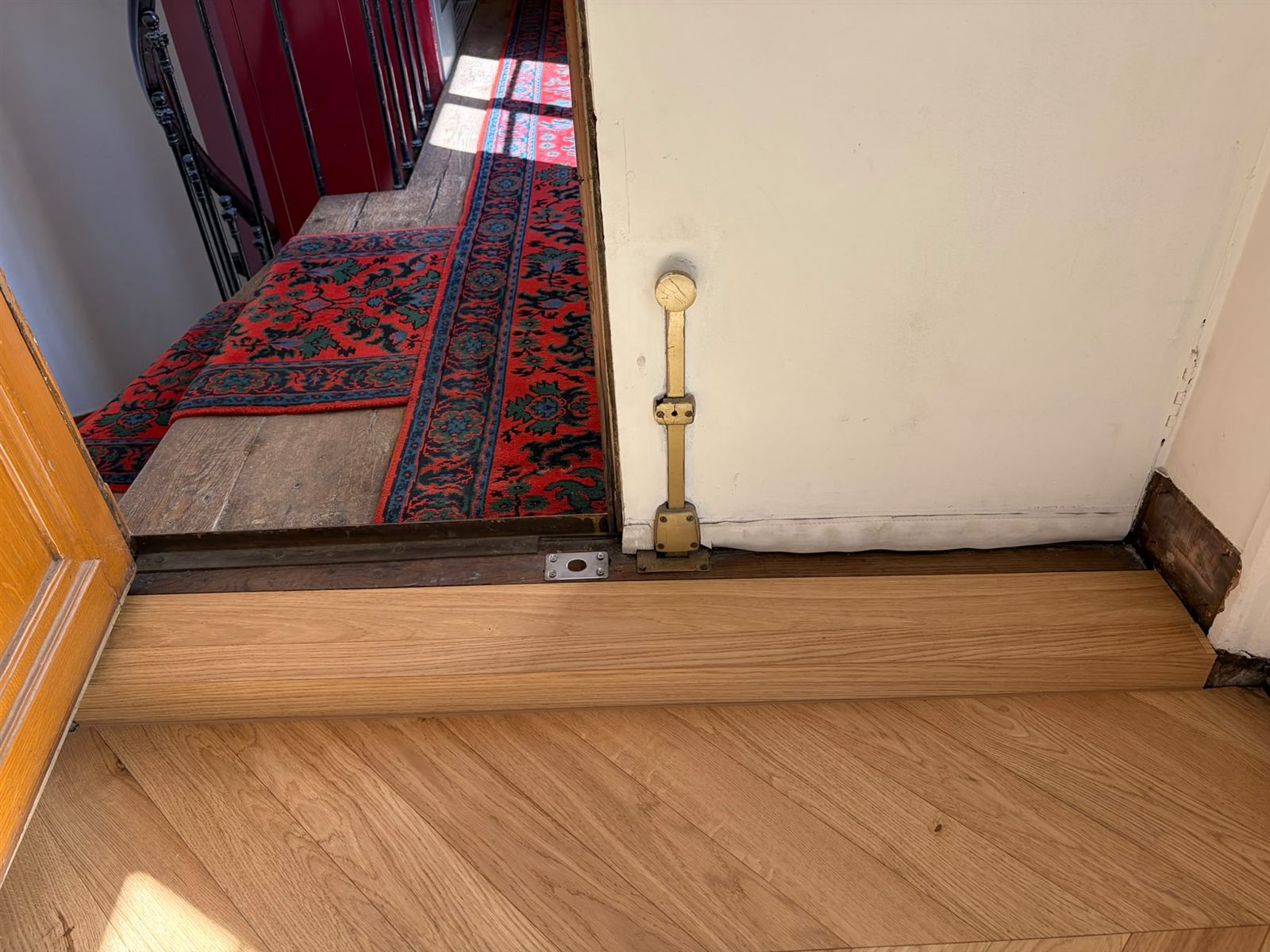 Transition de niveau entre le nouveau parquet et le palier