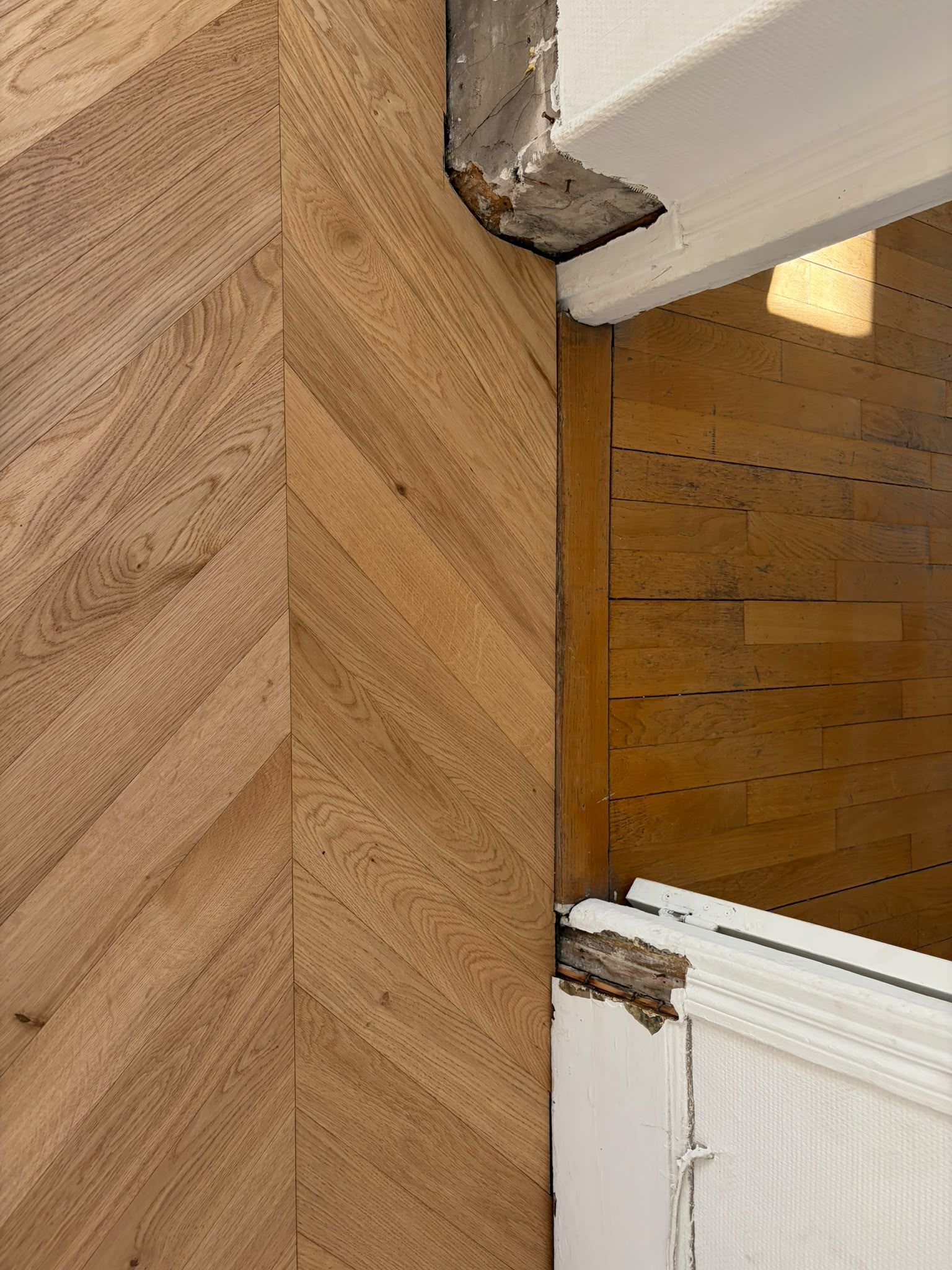 Détail du raccord entre le nouveau parquet et le plancher existant